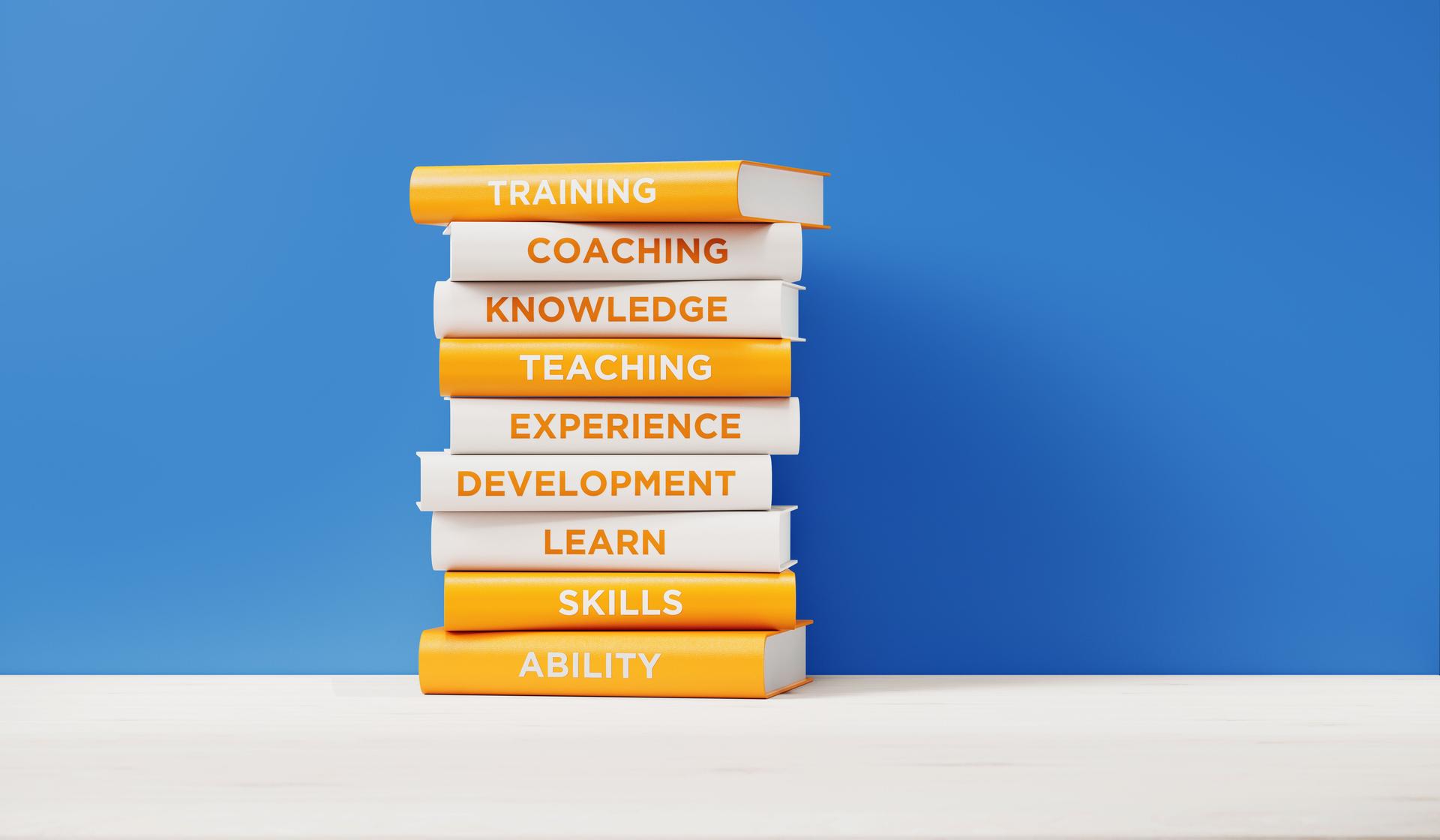 Books of  Training And Development in Front of Blue Wall